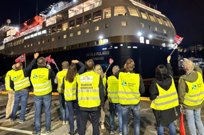 Employees of Havila Voyages greet Havila Polaris as she arrives in Bergen.